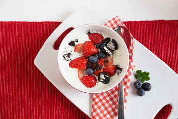 Fresh strawberries with yoghurt for breakfast