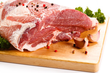 Fresh raw pork on cutting board on white background