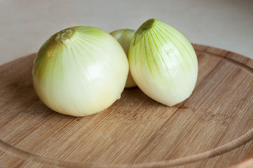 Onion on wooden board