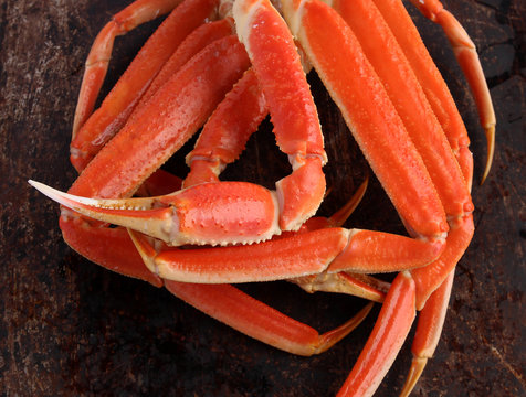 Crab legs on brown background