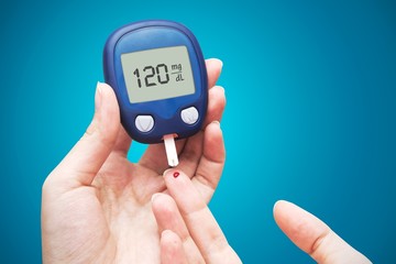 Woman doing blood sugar test