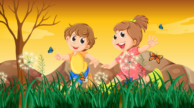A girl and a boy playing with the butterflies