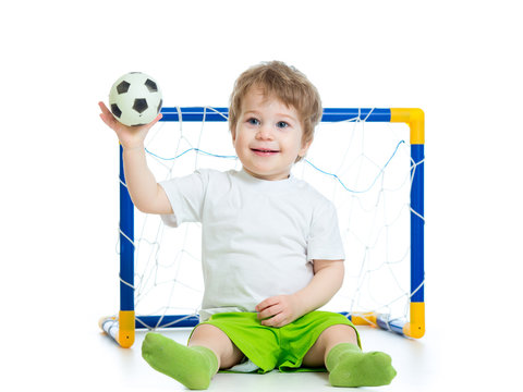 Kid Football Player Holding Soccer Ball