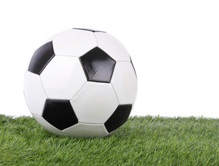 Fototapeta na wymiar Stitch leather soccer ball on green grass field.