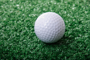 Golf ball ower green grass