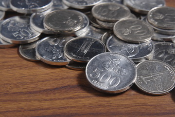 coin rupiah at wooden table