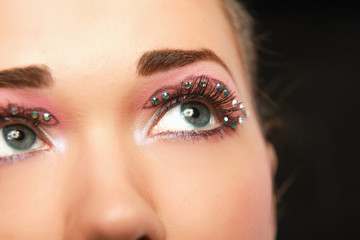 Naklejka premium Woman eye with exotic style makeup