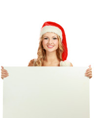 Beautiful christmas woman in santa hat holding empty board