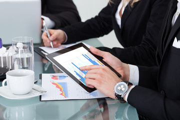 Businesspeople Working At Desk