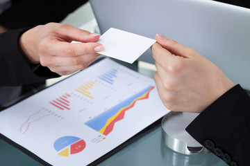 Businesswomen Exchanging Business Card
