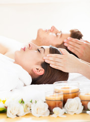 Obraz na płótnie Canvas Couple Receiving Head Massage