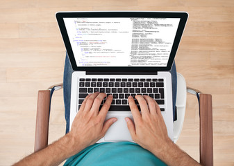 Fototapeta premium Man Using Laptop At Home