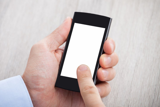Businessman's Hand Holding Smartphone With Blank Screen