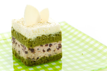 Matcha green tea cake isolated on white background
