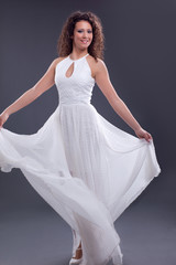 Fototapeta premium Sexy elegant woman wearing long white dress