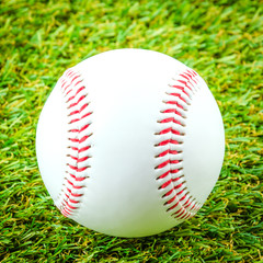 Baseball on green grass