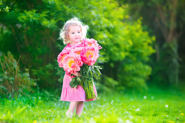 Little girl with peany flowers