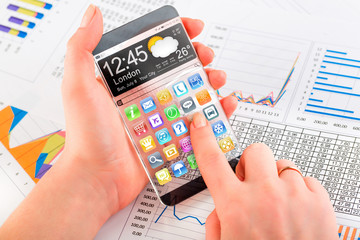 Smartphone with transparent screen in human hands.