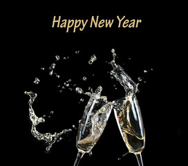 Glasses of champagne with splash, on black background