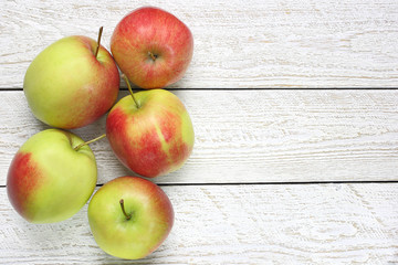 Fresh apples on wooden table