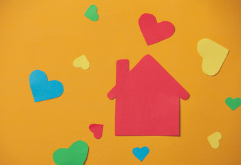 paper house on yellow background