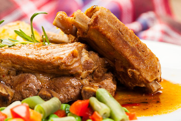 Pork spareribs served with mashed potatoes