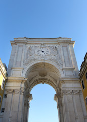 Old arch with watch in the center of Lisbon