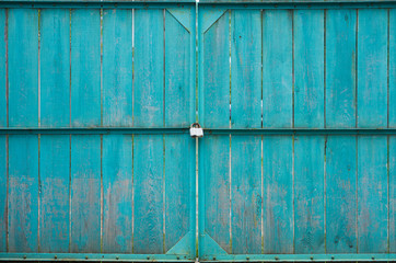 Wooden gates with padlock