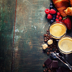 Coffee with croissants and berries