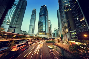 Fotobehang verkeer in Hong Kong bij zonsondergang © Iakov Kalinin