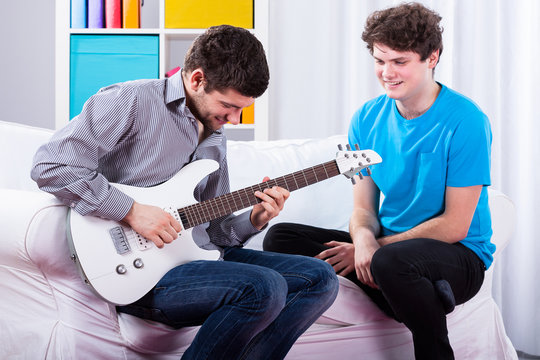 Friends Playing Electric Guitar