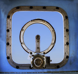 old military war ship window against blue sky background use for © stockphoto mania