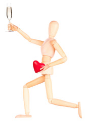Fototapeta na wymiar wooden Dummy with champagne holding red heart
