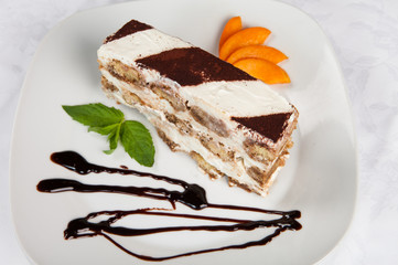 Slice of self-made italian tiramisu dessert served on a plate