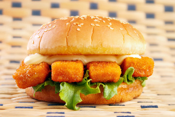 Fishburger with fish sticks and mayonnaise