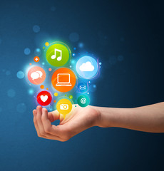 Multimedia icons in the hand of a woman