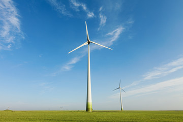 Wind power field with blue sky and white clouds