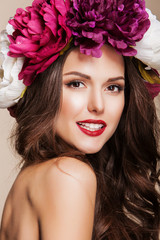 beautiful happy woman with bright flowers on her head and red