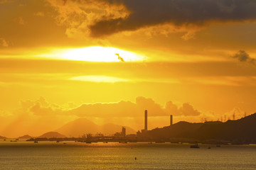Fototapeta na wymiar Power plant at sunset