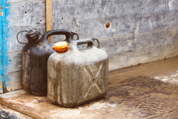 Plastic fuel canisters. Vintage retro photo.