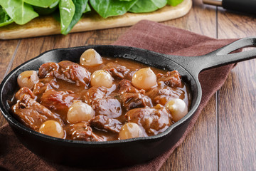 goulash meat in a frying pan