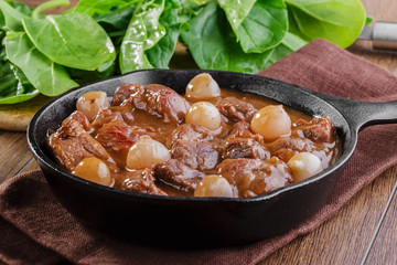 goulash meat in a frying pan