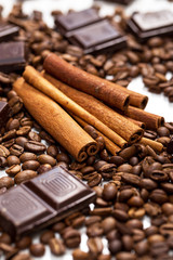 Coffee beans, cinnamon stick and chocolate