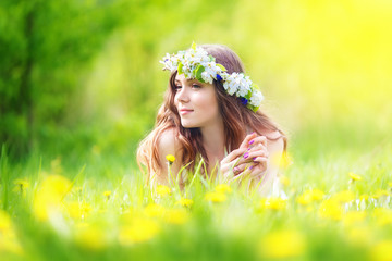 Image of pretty woman lying down on dandelions field, happy  che