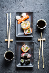 Obraz na płótnie Canvas Sushi for two served on black stone