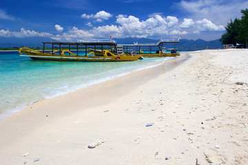Yellow boats on beach on Gili Trawangan island