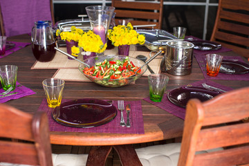 Beautiful home served table for dinner on the veranda