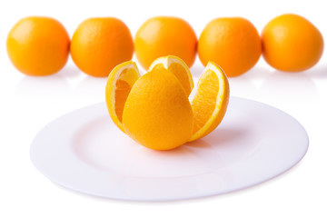 orange on plate with blurred background