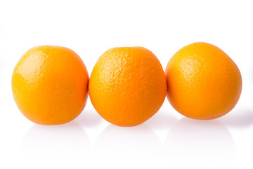 three ripe oranges