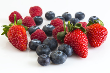 ripe berry of raspberries, strawberries and blueberries